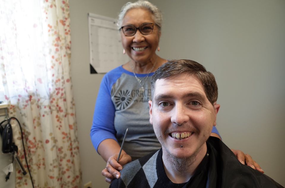 A Grace Center participant getting a hair cut in Grace Center's salon